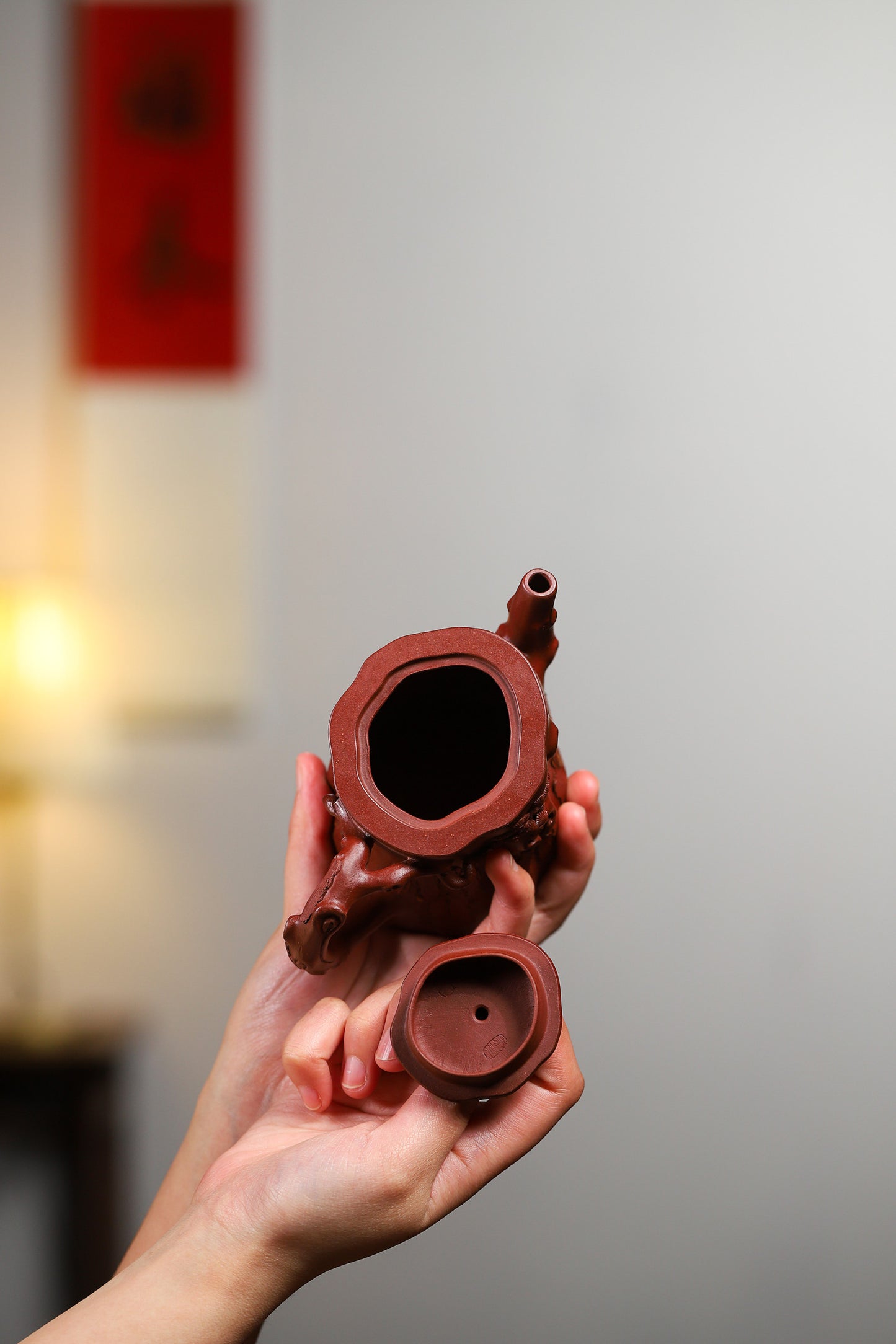 Handcrafted Yixing purple sand teapot and cup, showcasing intricate details and authentic craftsmanship.