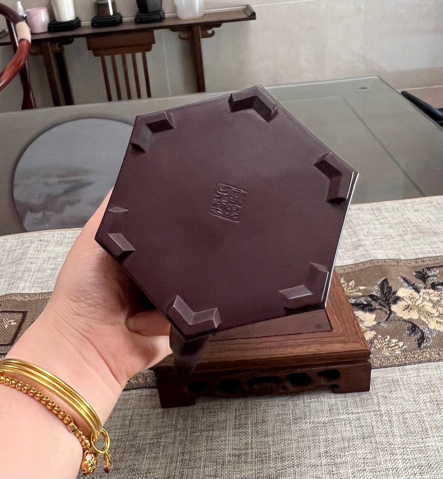 Handmade Yixing purple sand teapot base showing hexagonal shape and quality craftsmanship.