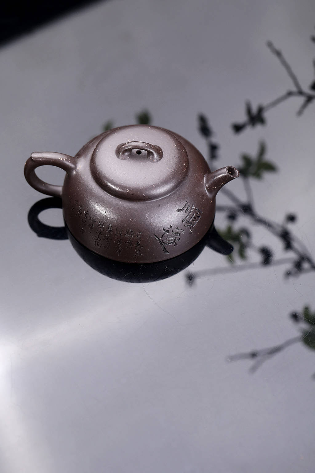 Handmade Yixing purple sand teapot by 蒋建华老师, featuring traditional craftsmanship and elegant design.
