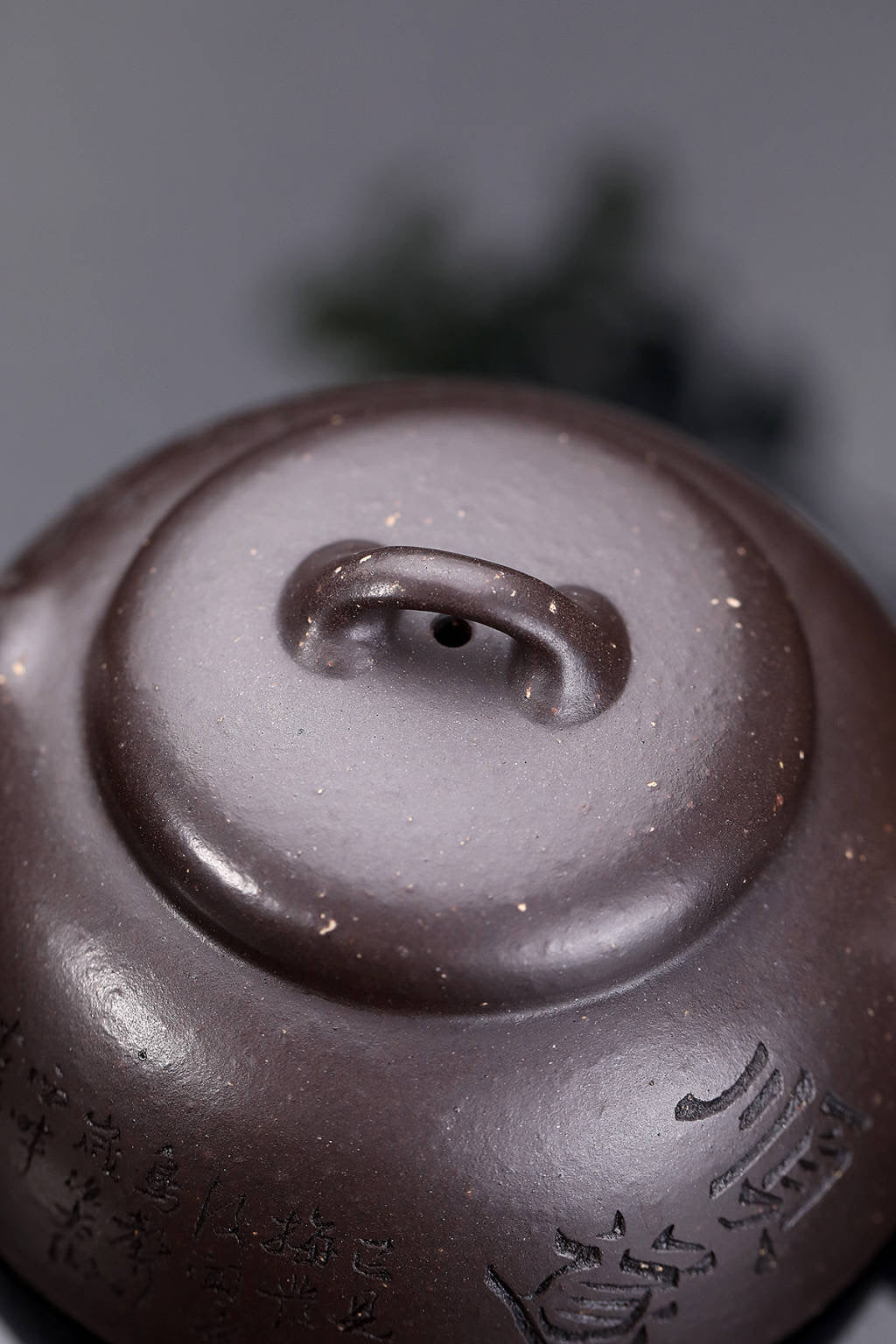 Top view of a handmade Yixing purple sand teapot showcasing intricate craftsmanship and unique glaze.