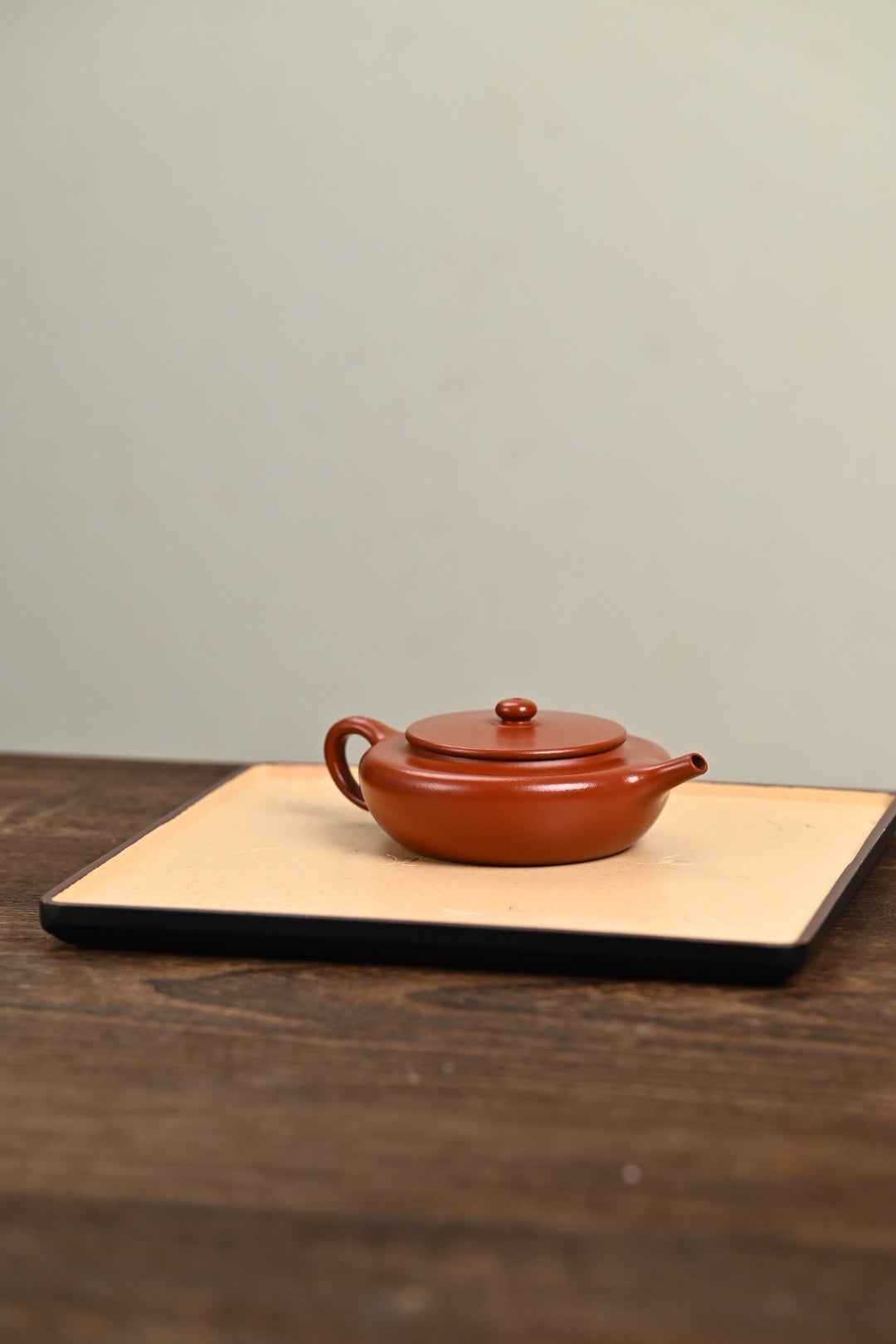 Handmade Yixing purple sand teapot by Wang, featuring a 150CC capacity and traditional design.