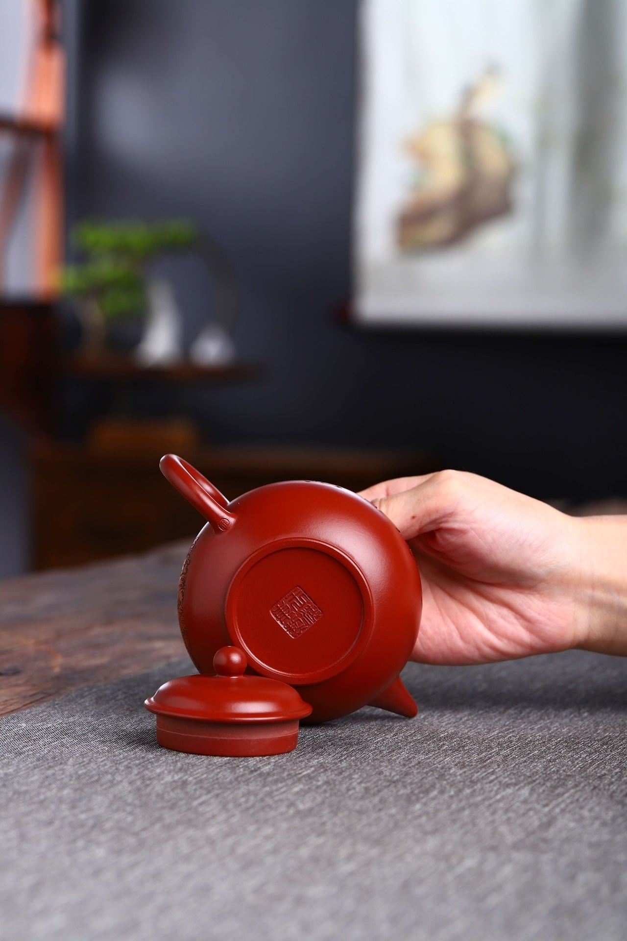 Handmade Yixing purple sand teapot with lid, showcasing traditional craftsmanship and unique design.
