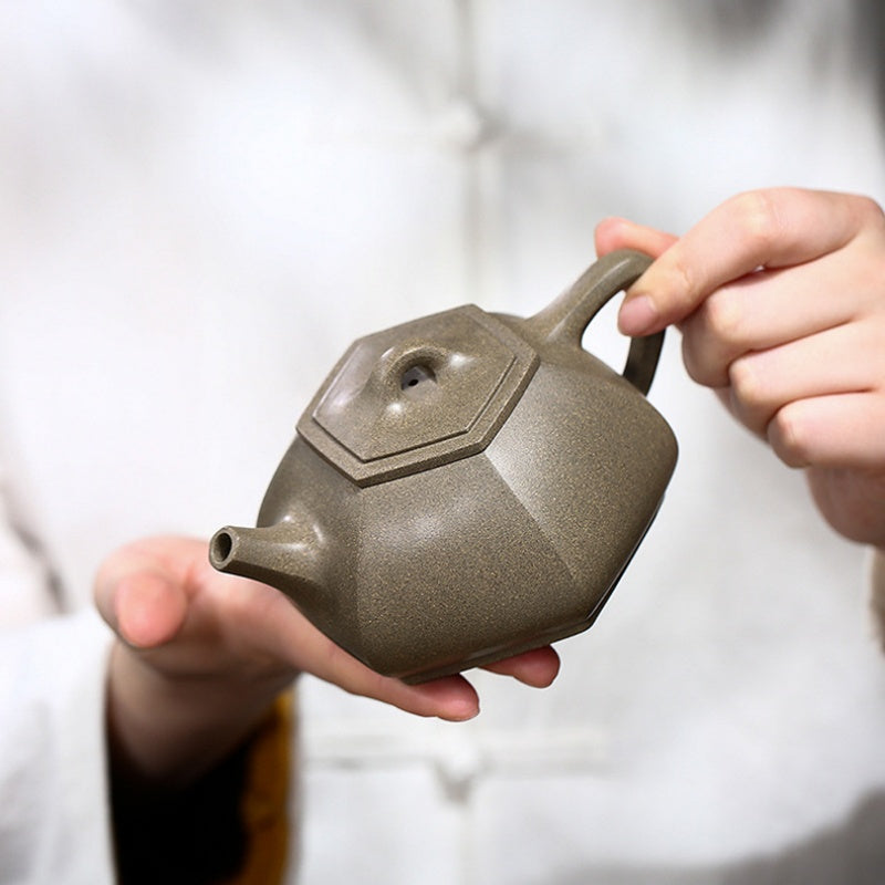 Handmade Yixing Zisha teapot crafted from original purple sand by an expert Yixing craftsman.