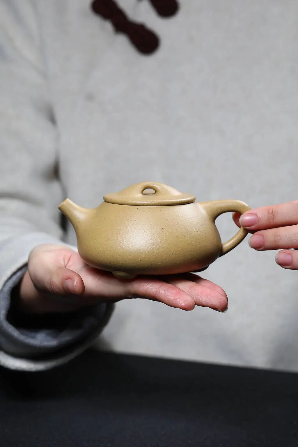 Handmade Yixing Zisha teapot crafted from original purple sand by an expert Yixing craftsman.
