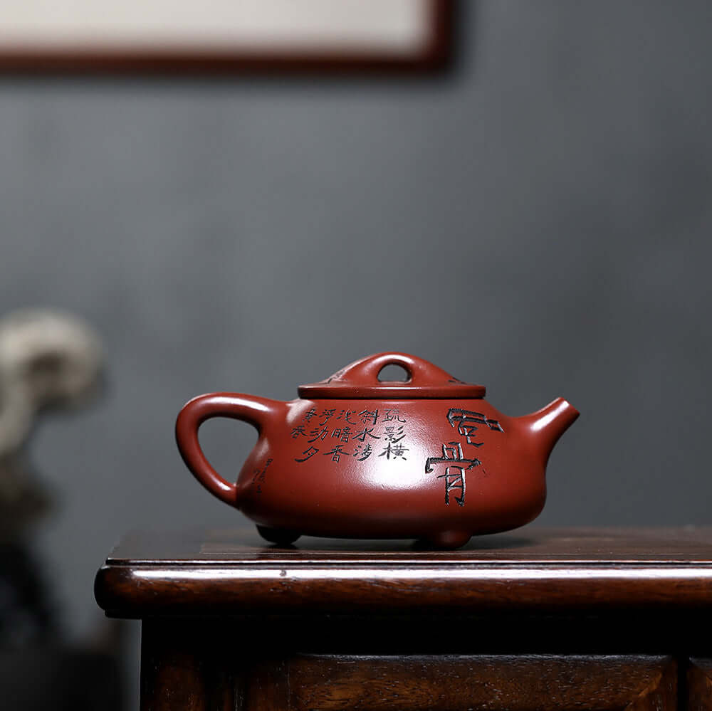 Handmade Yixing purple sand teapot with inscriptions, showcasing exquisite craftsmanship for kung fu tea ceremonies.