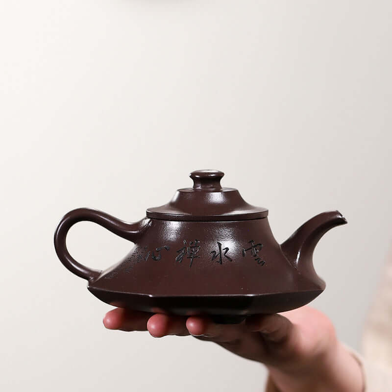 Handmade Yixing purple sand teapot with elegant design, showcasing craftsmanship and traditional tea culture.
