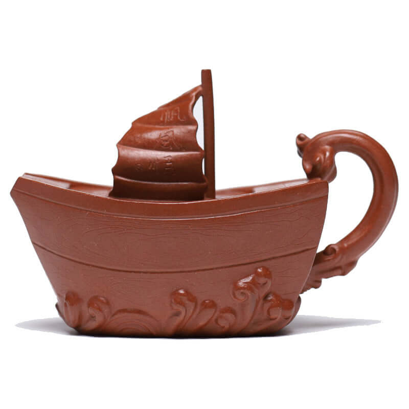 Handmade Yixing purple sand teapot designed as a boat, showcasing elegant craftsmanship and unique aesthetic for Kung Fu tea.