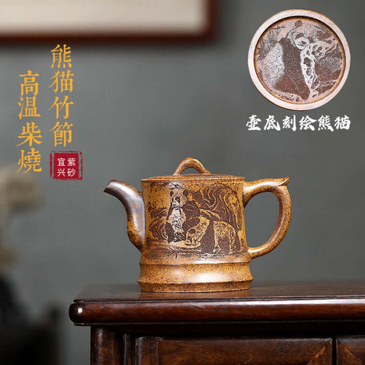 Handmade Yixing purple sand teapot featuring panda and bamboo design, crafted from raw ore, high-temperature fired.