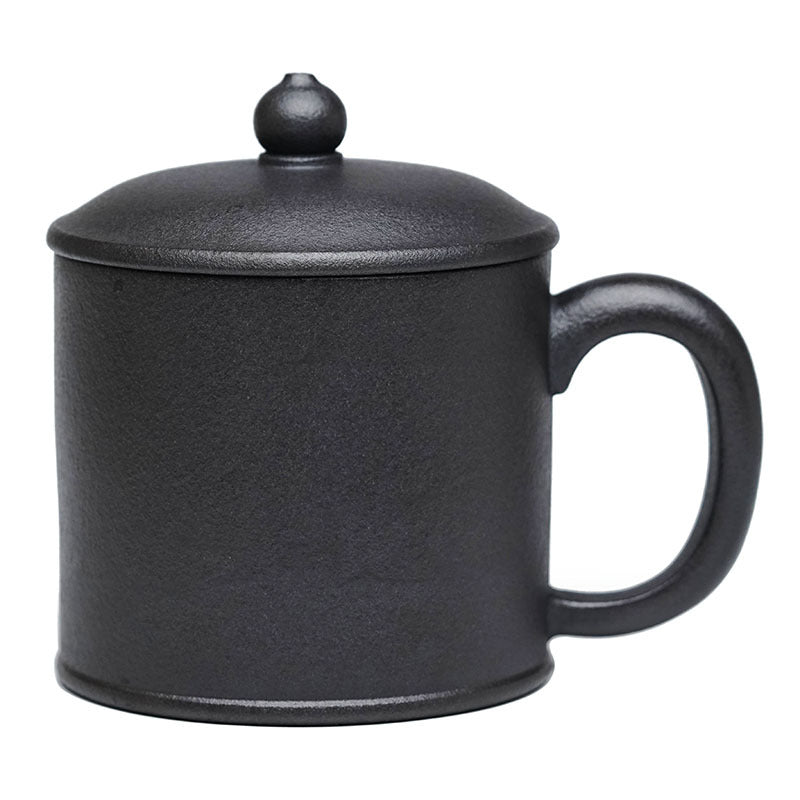 Handmade black ceramic tea cup with lid, perfect for brewing and serving tea.