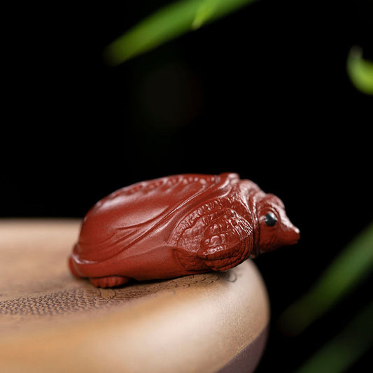 Handmade Yixing purple sand tea pet ornament, rich armor design, ideal for tea lovers and collectors.