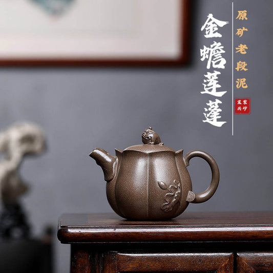 Handmade Yixing purple sand teapot featuring a lotus and golden toad design, perfect for home kung fu tea sets.