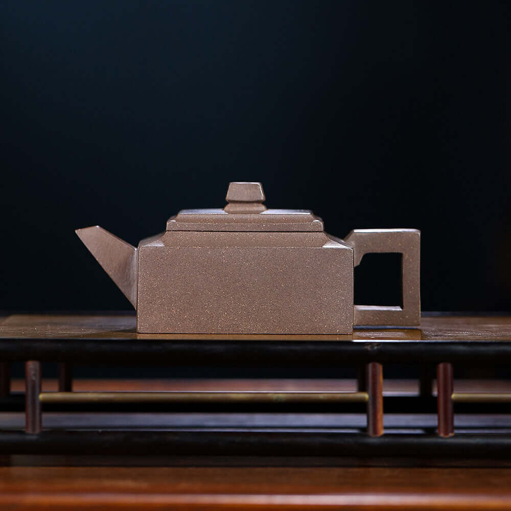 Handmade Yixing purple sand teapot, square design, crafted by Yixing artisans, perfect for tea enthusiasts.