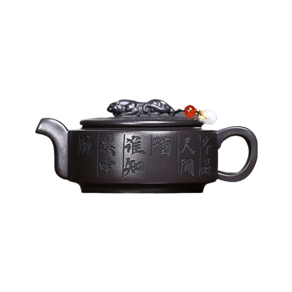 Handmade Yixing purple sand teapot featuring intricate designs, ideal for Kung Fu tea brewing at home.