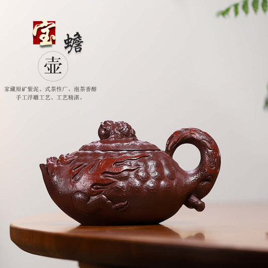Handmade Yixing purple sand teapot featuring intricate design, symbolizing wealth and prosperity, ideal for tea enthusiasts.