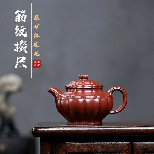 Handmade Yixing purple sand teapot with dragon rib pattern, perfect for kung fu tea sets and home use.