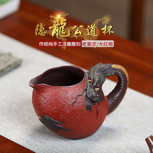 Handmade Yixing purple sand fair cup featuring a dragon design, showcasing traditional craftsmanship and elegant texture.