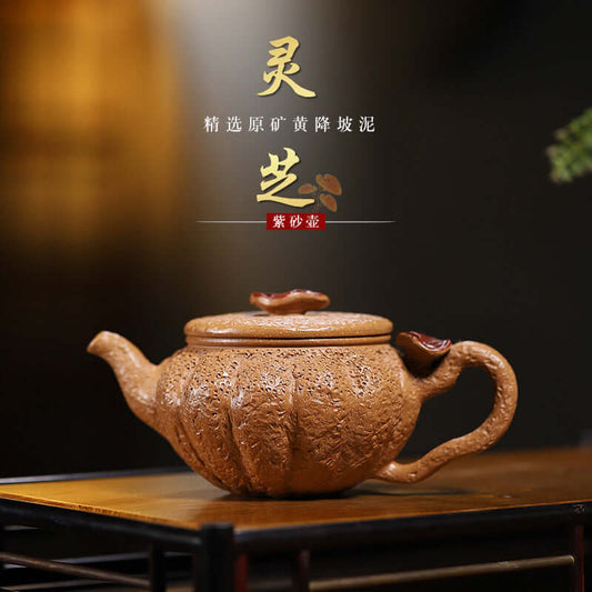 Handmade Yixing purple sand teapot featuring Ganoderma lucidum design with exquisite craftsmanship.