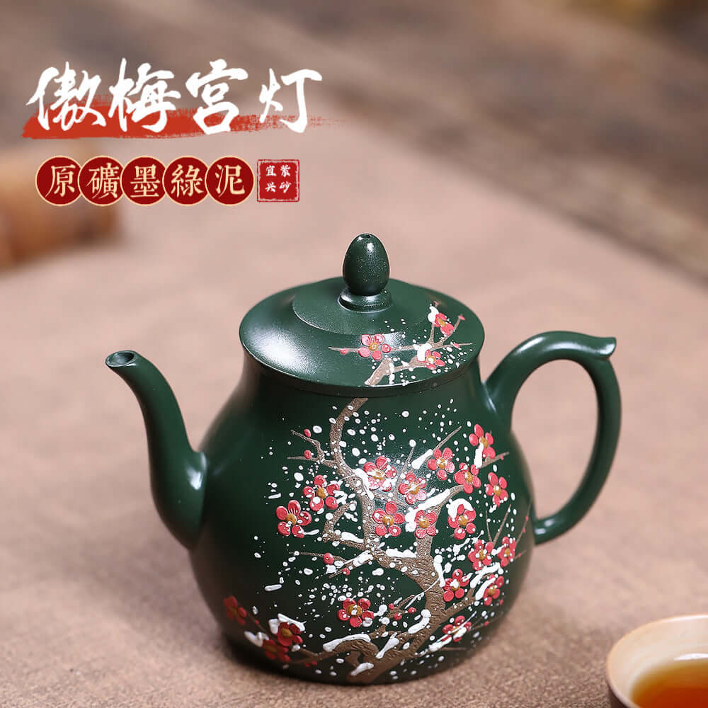 Handmade Yixing purple sand teapot in ink green mud with floral design, ideal for kung fu tea sets.