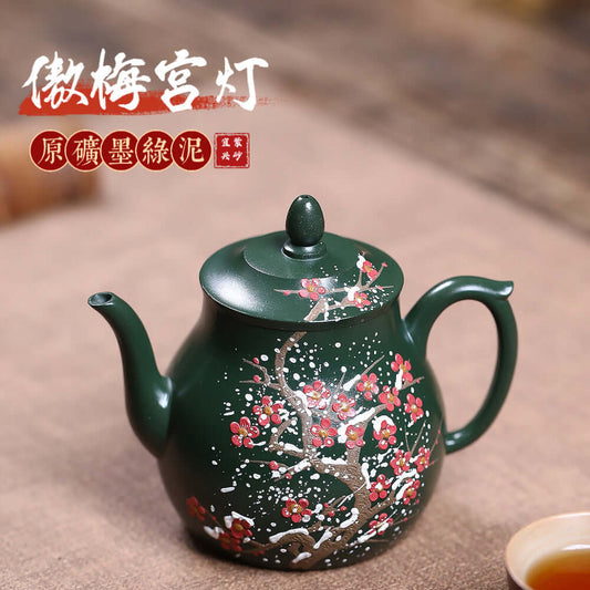 Handmade Yixing purple sand teapot in ink green mud with floral design, ideal for kung fu tea sets.