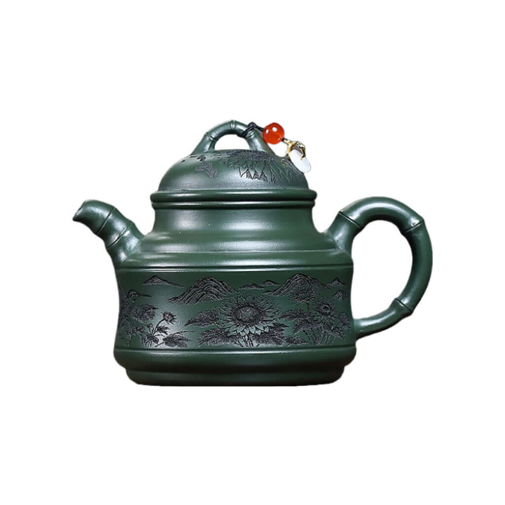 Handmade Yixing purple sand teapot with floral and bird engravings, crafted from original mineral green clay.