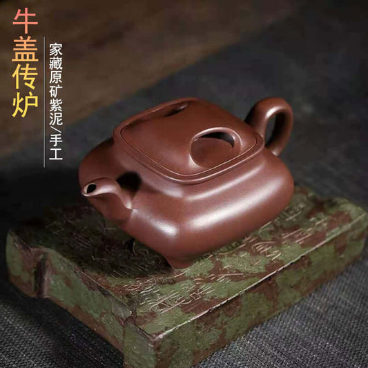 Handmade Yixing purple sand teapot, crafted by artisans, featuring original purple clay design and cow cover.