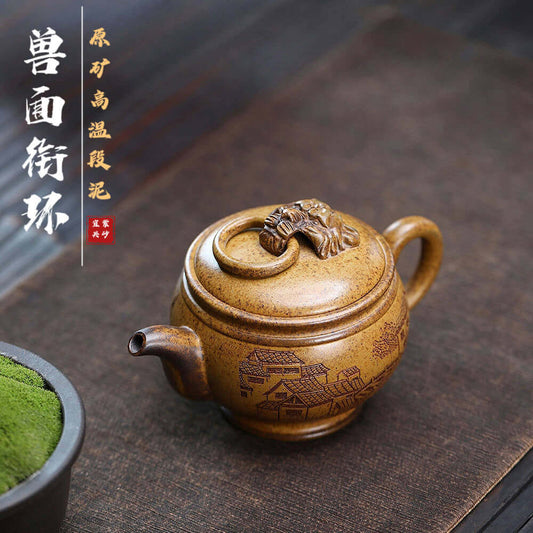 Handmade Yixing purple sand teapot with intricate animal design, perfect for kung fu tea set. Original craftsmanship.