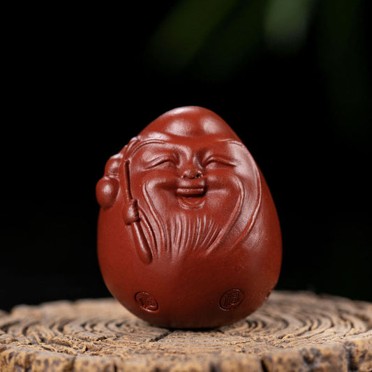 Handmade Yixing purple sand tea pet ornament, happy egg design, perfect gift for tea lovers.