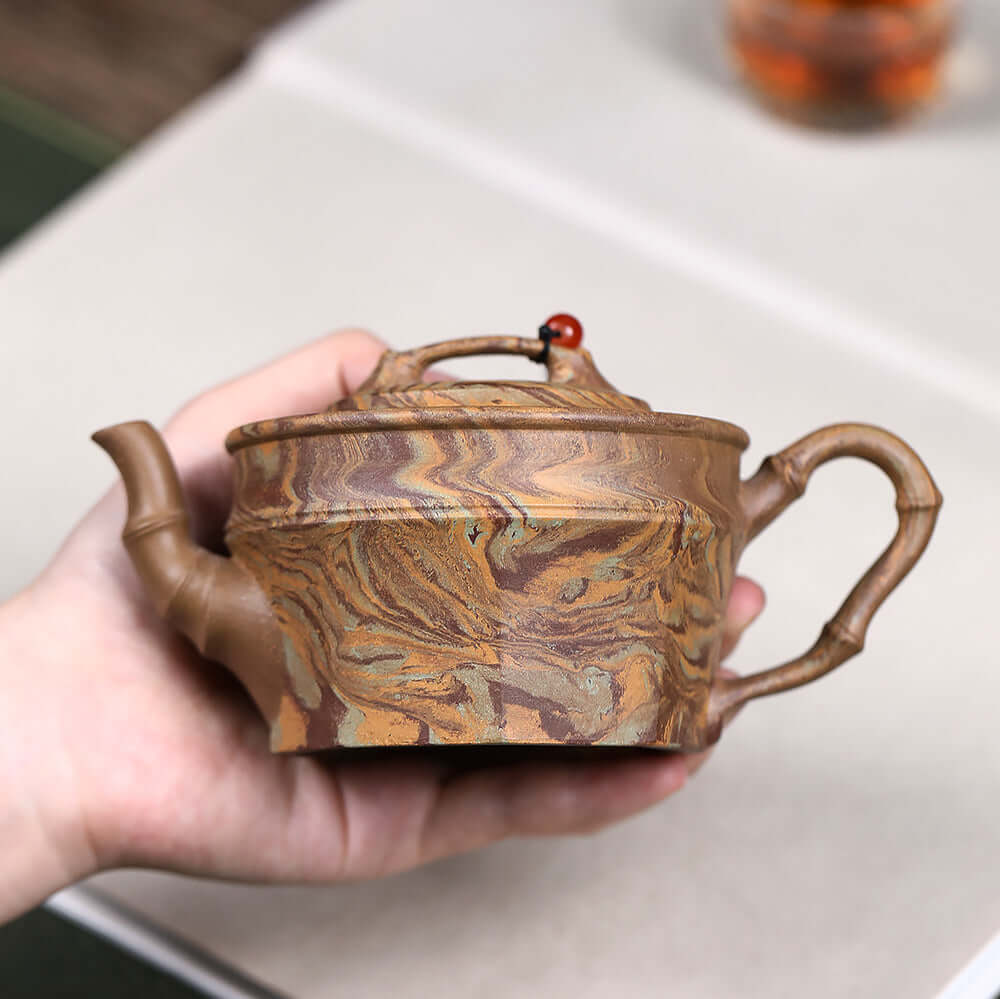 Handmade Yixing purple sand teapot with twisted mud design, ideal for Kung Fu tea set and home brewing.