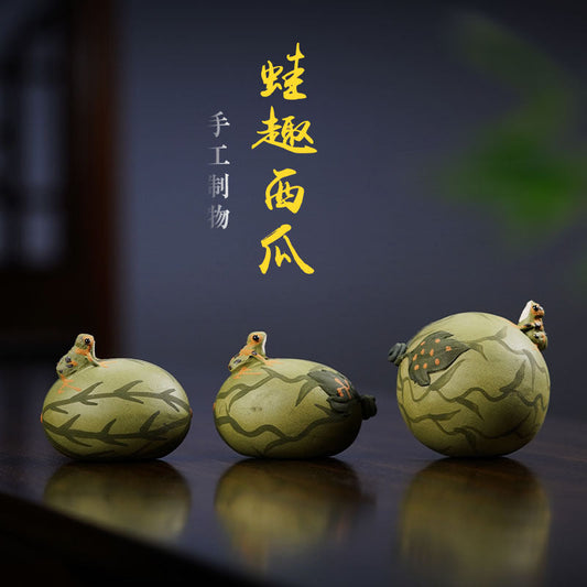 Handmade Yixing purple sand tea pet ornaments featuring whimsical frog designs, perfect for tea enthusiasts.