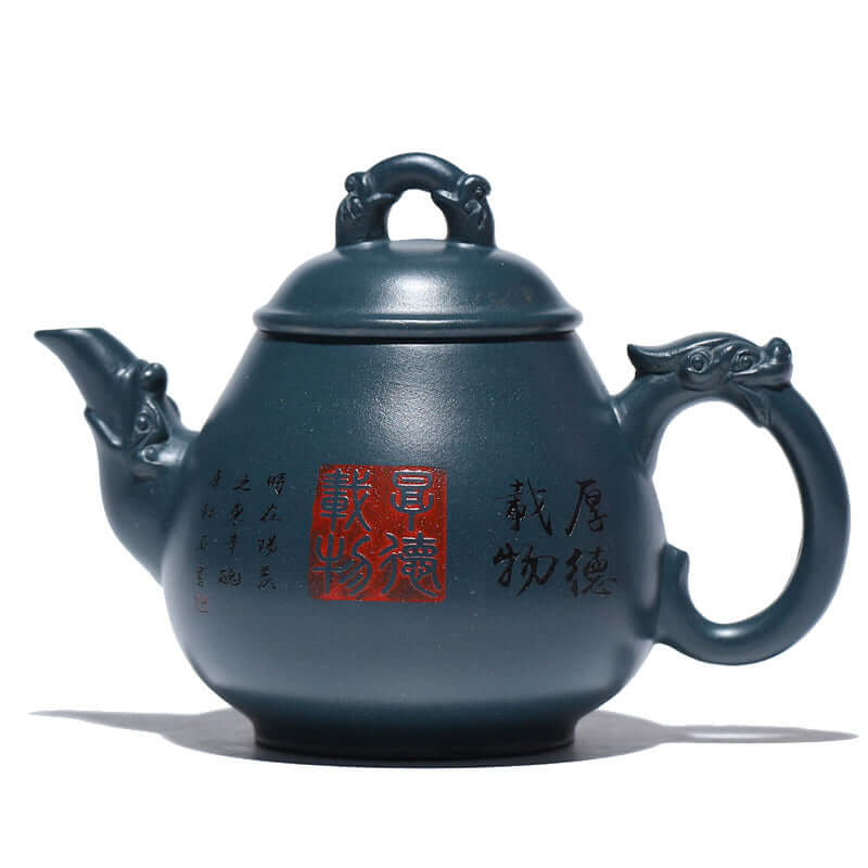 Handmade Yixing purple sand teapot featuring intricate designs and a classic shape, perfect for tea enthusiasts.