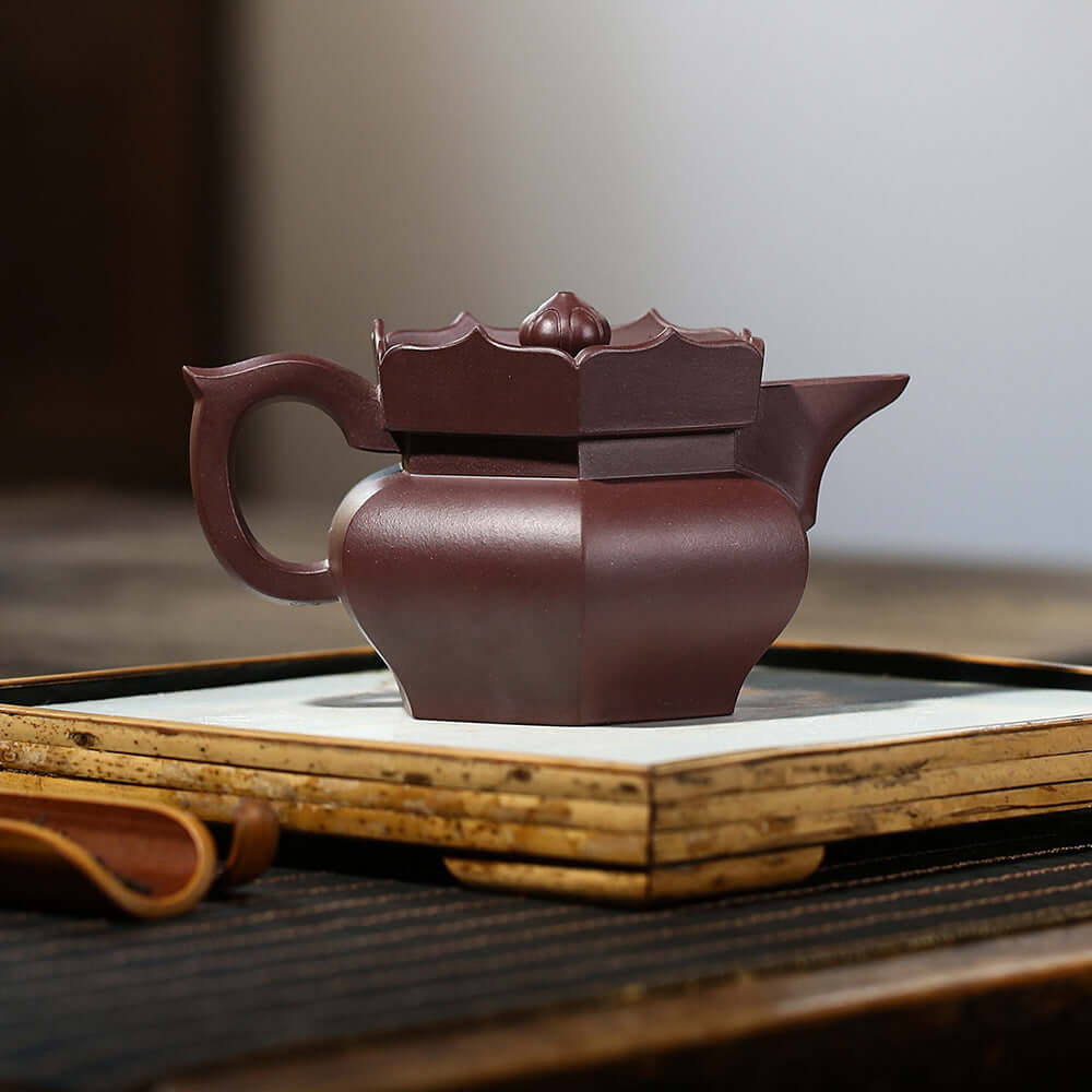 Handmade Yixing purple sand teapot featuring a square design, perfect for tea enthusiasts and high-end gift options.