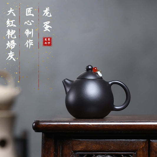 Handmade Yixing purple sand teapot with a smooth finish, perfect for Kung Fu tea sets.