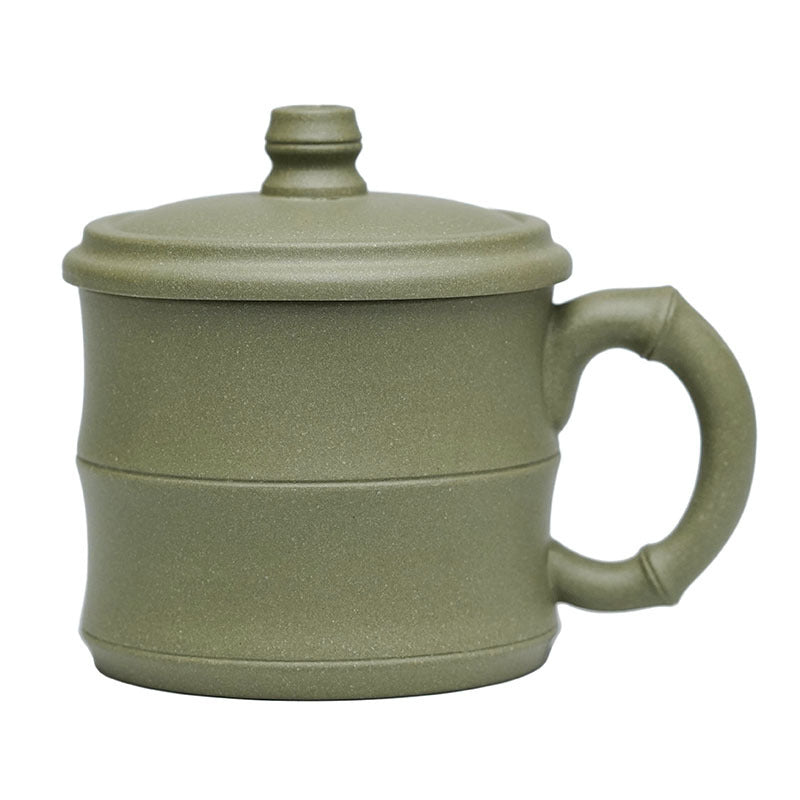 Handmade Yixing purple sand teapot with bamboo section design, ideal for tea water separation and manual filtering in the office.