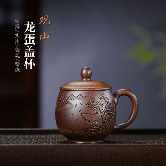 Handmade Yixing purple sand tea cup with lid, charcoal-fired dragon egg design, perfect for mountain view tea enjoyment.