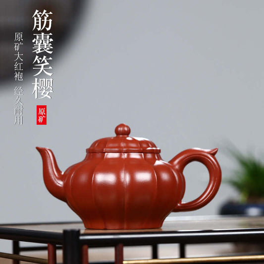 Handmade Yixing purple sand teapot in classic design, featuring rich color and elegant curves, perfect for kung fu tea.