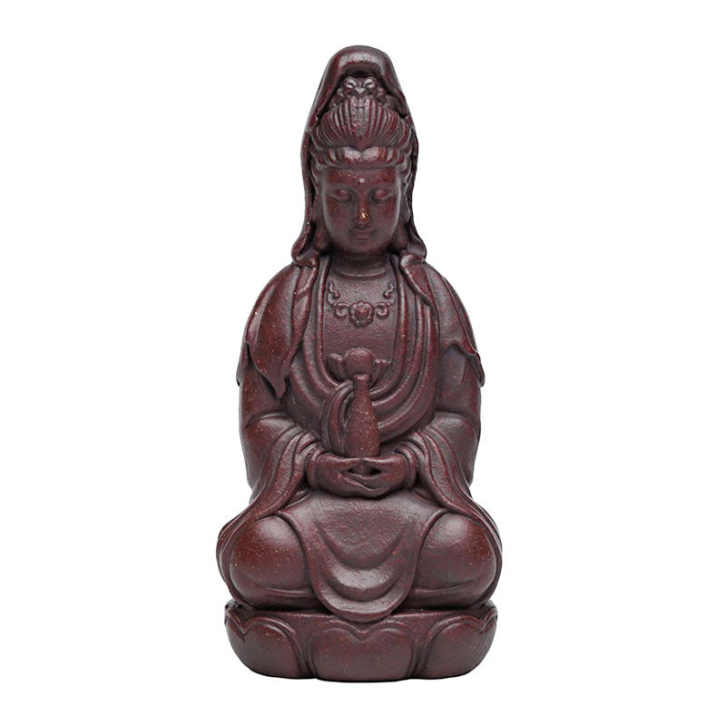 Handmade Yixing purple sand sculpture of Guanyin, a character ornament for tea sets and incense, crafted by Yixing artisans.