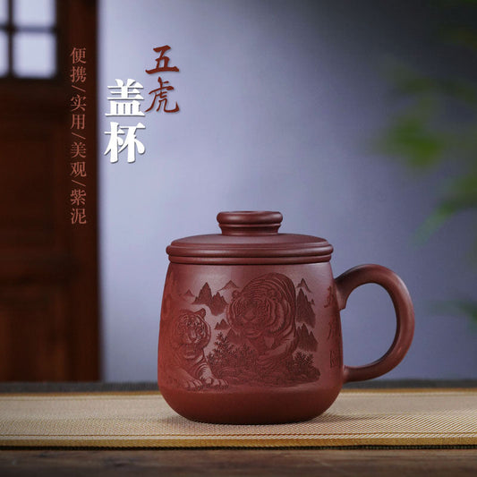 Handmade Yixing purple sand tea cup with engraved tiger design, perfect for tea lovers and office gifting.
