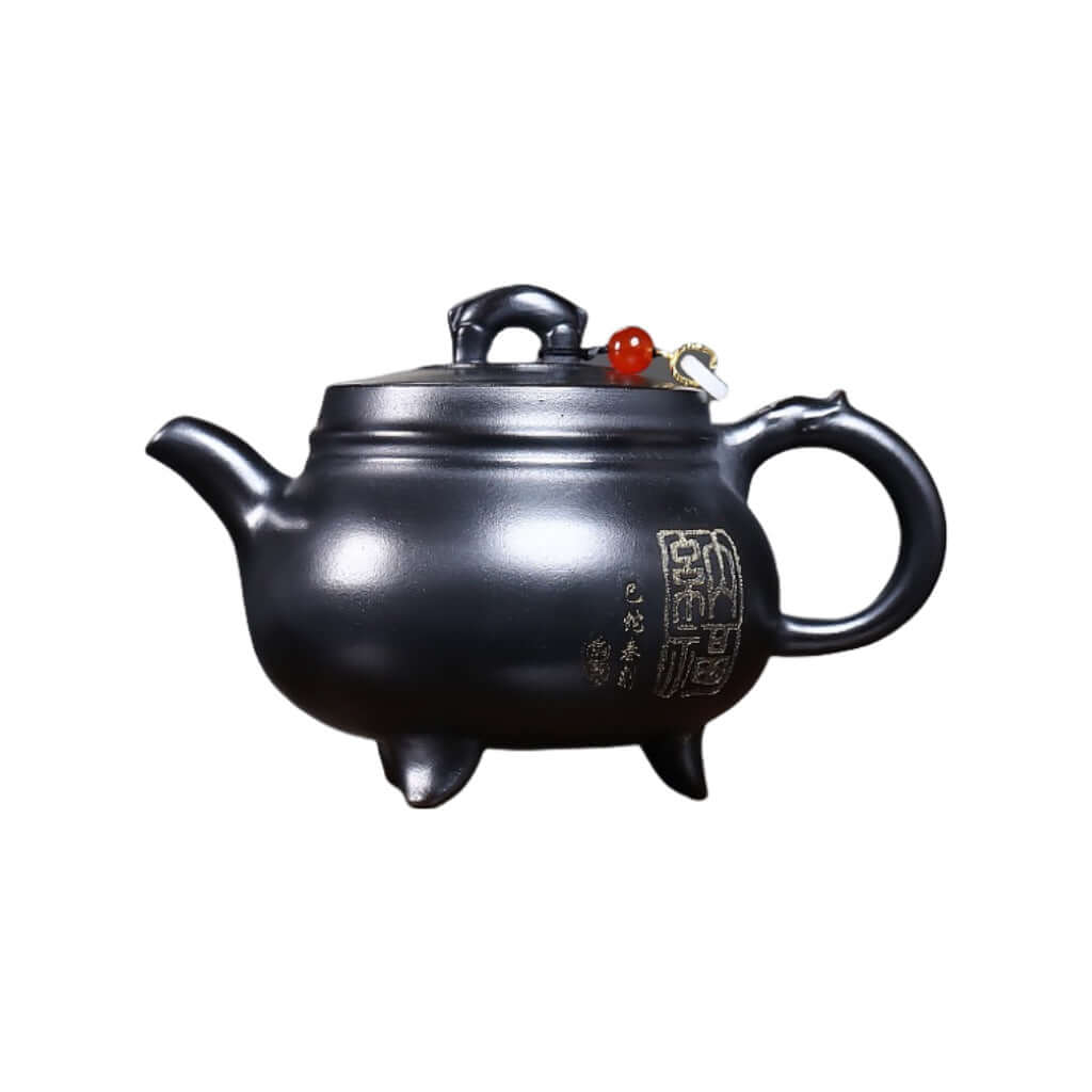 Handmade Yixing purple sand teapot with three legs, featuring original mineral design for Kung Fu tea set.