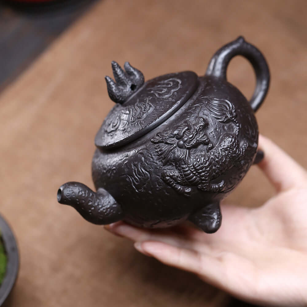 Handmade Yixing purple sand teapot featuring intricate Kirin tread design, ideal for kung fu tea set and traditional brewing.