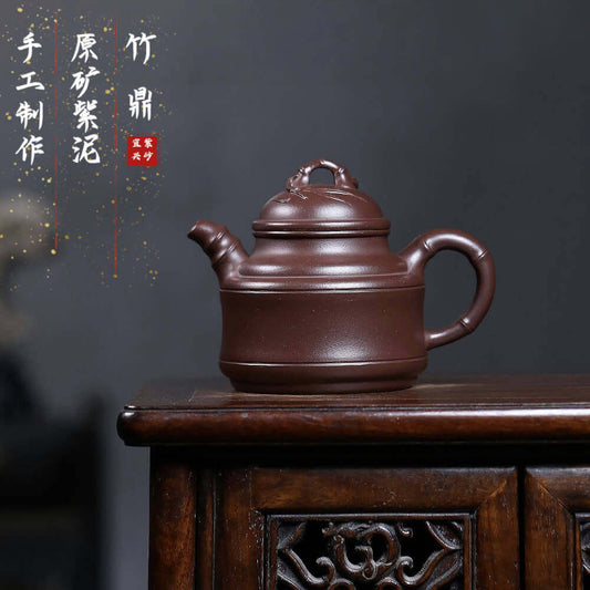 Handmade Yixing purple sand teapot featuring a bionic bamboo tripod design, ideal for Kung Fu tea sets.