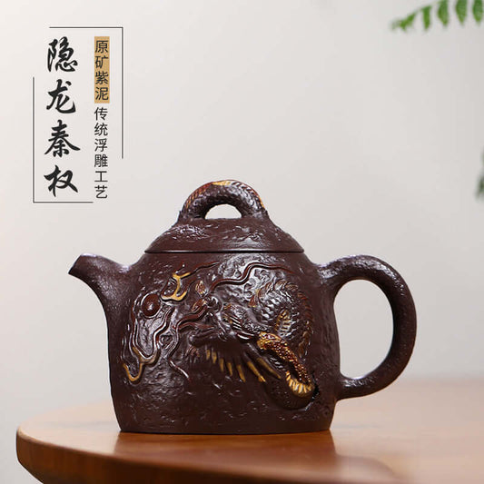 Handmade Yixing purple sand teapot featuring traditional relief dragon design, showcasing unique craftsmanship and elegance.