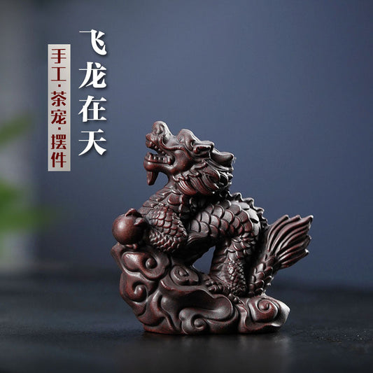 Handmade Yixing purple sand dragon tea pet ornament for tea ceremony, showcasing intricate craftsmanship.