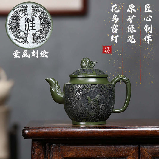 Handmade Yixing purple sand teapot with original green clay carving, featuring flower and bird design.