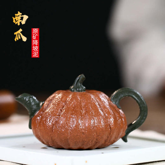 Handmade Yixing purple sand pumpkin teapot, showcasing fine craftsmanship and bionic design, perfect for tea lovers.