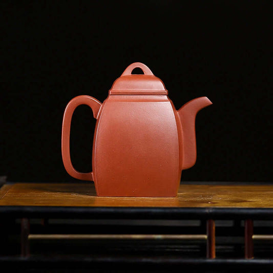 Handmade Yixing purple sand teapot crafted from original purple sand, showcasing elegant design and craftsmanship.