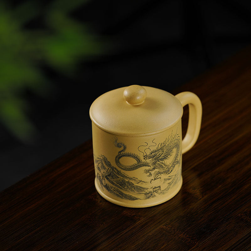 Handmade Yixing purple sand office cup with engraved dragon design, perfect for tea enthusiasts.