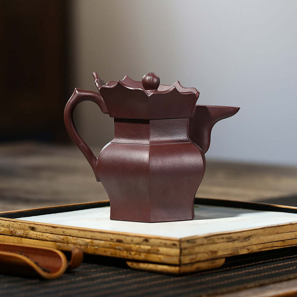 Handmade Yixing purple sand teapot with unique square design, high-end gift for tea lovers.