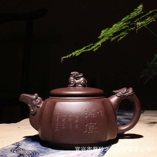 Handmade Yixing purple sand teapot with intricate dragon lid design, showcasing elegant craftsmanship and traditional style.