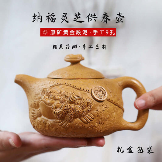 Handmade Yixing purple sand teapot featuring a traditional design with a golden toad, 370cc capacity in a gift box.