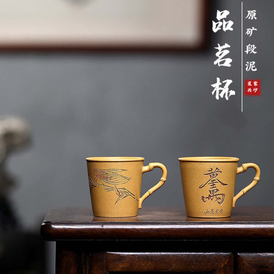 Handmade Yixing purple sand cups carved with bamboo, perfect for Kung Fu tea sets at home.